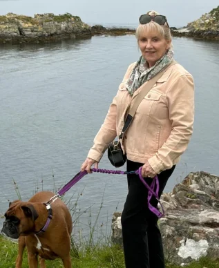 Karen, Therapist in Cumbernauld, Airdrie and Online with her boxer dog, Freya